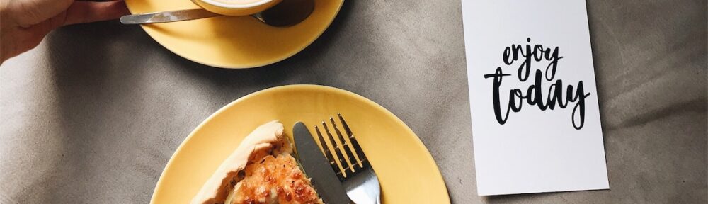 sliced of pizza and coffee latte